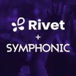 People with raised hands in a crowd, with "Rivet + Symphonic" text overlay on a purple background.