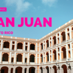 A large, historic building with multiple arches stands majestically under a blue sky, each arch whispering a story of San Juan, Puerto Rico.