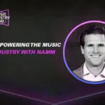 Black and white image featuring a circular inset of a smiling person. Text reads, "Empowering the Music Industry with NAMM" and "Explore Music Industry 360.