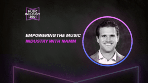 Black and white image featuring a circular inset of a smiling person. Text reads, "Empowering the Music Industry with NAMM" and "Explore Music Industry 360.