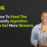 A person smiling in front of a black background with text: "How To Feed The Spotify Algorithm To Get More Streams and maximize your Spotify success.