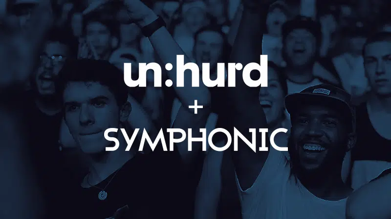 A crowd at a concert with a blue tint overlay shows people enjoying themselves, highlighting the synergy of partners. The text "un:hurd + SYMPHONIC" is prominently displayed.