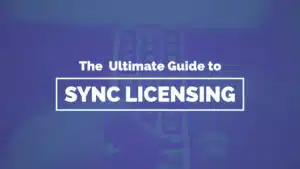 A blue-tinted image features the text "The Ultimate Guide to Sync Licensing" overlaying a blurred close-up of a hand holding a remote control, perfectly capturing the essence of sync licensing for media professionals.