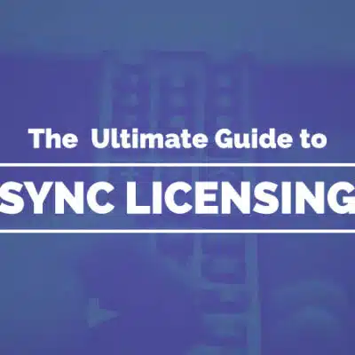 A blue-tinted image features the text "The Ultimate Guide to Sync Licensing" overlaying a blurred close-up of a hand holding a remote control, perfectly capturing the essence of sync licensing for media professionals.