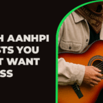 A person wearing a tan jacket and patterned bandana plays an acoustic guitar beside text celebrating AANHPI artists.