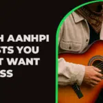 A person wearing a tan jacket and patterned bandana plays an acoustic guitar beside text celebrating AANHPI artists.
