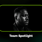 Black and white portrait of a man looking to the side, framed by a green border with the text "Team Spotlight" below the image.