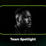 Black and white portrait of a man looking to the side, framed by a green border with the text "Team Spotlight" below the image.