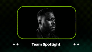Black and white portrait of a man looking to the side, framed by a green border with the text "Team Spotlight" below the image.