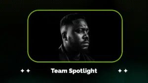 Black and white portrait of a man looking to the side, framed by a green border with the text "Team Spotlight" below the image.