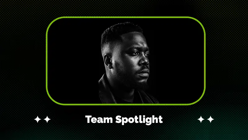 Black and white portrait of a man looking to the side, framed by a green border with the text "Team Spotlight" below the image.