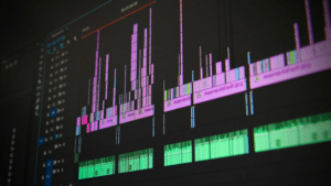 SongTools x Symphonic Case Study: Academia Boys A close-up of a computer screen displaying songtools digital audio or video editing software with multiple colored tracks and waveforms.