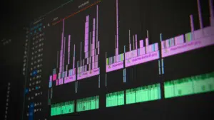 A close-up of a computer screen displaying songtools digital audio or video editing software with multiple colored tracks and waveforms.