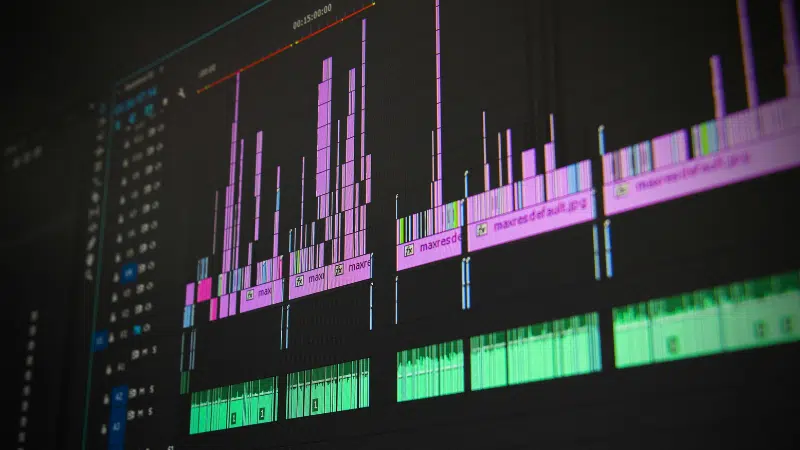 A close-up of a computer screen displaying songtools digital audio or video editing software with multiple colored tracks and waveforms.