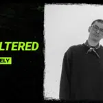 Black and white photo of J.Lately wearing glasses and a sweatshirt, next to text: "Symphonic Unfiltered with J.Lately" on a textured black background, capturing an unfiltered moment.