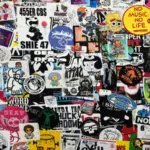 A wall densely covered with assorted colorful stickers, featuring various characters, logos, trademark slogans, and artistic designs overlapping each other.