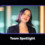 A woman with short dark hair wearing a black sequin jacket stands in front of a blurred background, representing her team. Text below reads "Team Spotlight.