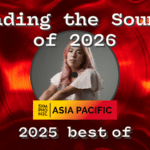 A person with long pink hair sits in front of a red vinyl record background, with the text: "Leading the Sounds of 2026, Symphonic Asia Pacific, 2025 best of.