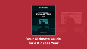 A book titled "The Ultimate Guide for a Kickass Year 2026" with a person at a computer in a studio, over a red background. Perfect for creatives, it's your Ultimate Guide for Musicians 2026 to achieve an epic year ahead.