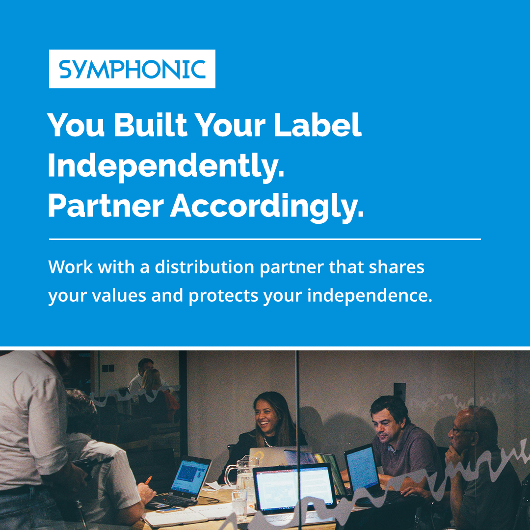 Yellow graphic with black text reading: "Two Decades In. Still Independent." Subtext explains Symphonic remains independently owned and supports indie labels. Partial view of people using devices at bottom.