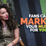 A woman sits on a chair holding a phone to her ear next to text that reads, "Fans can market your music for you with UGC.